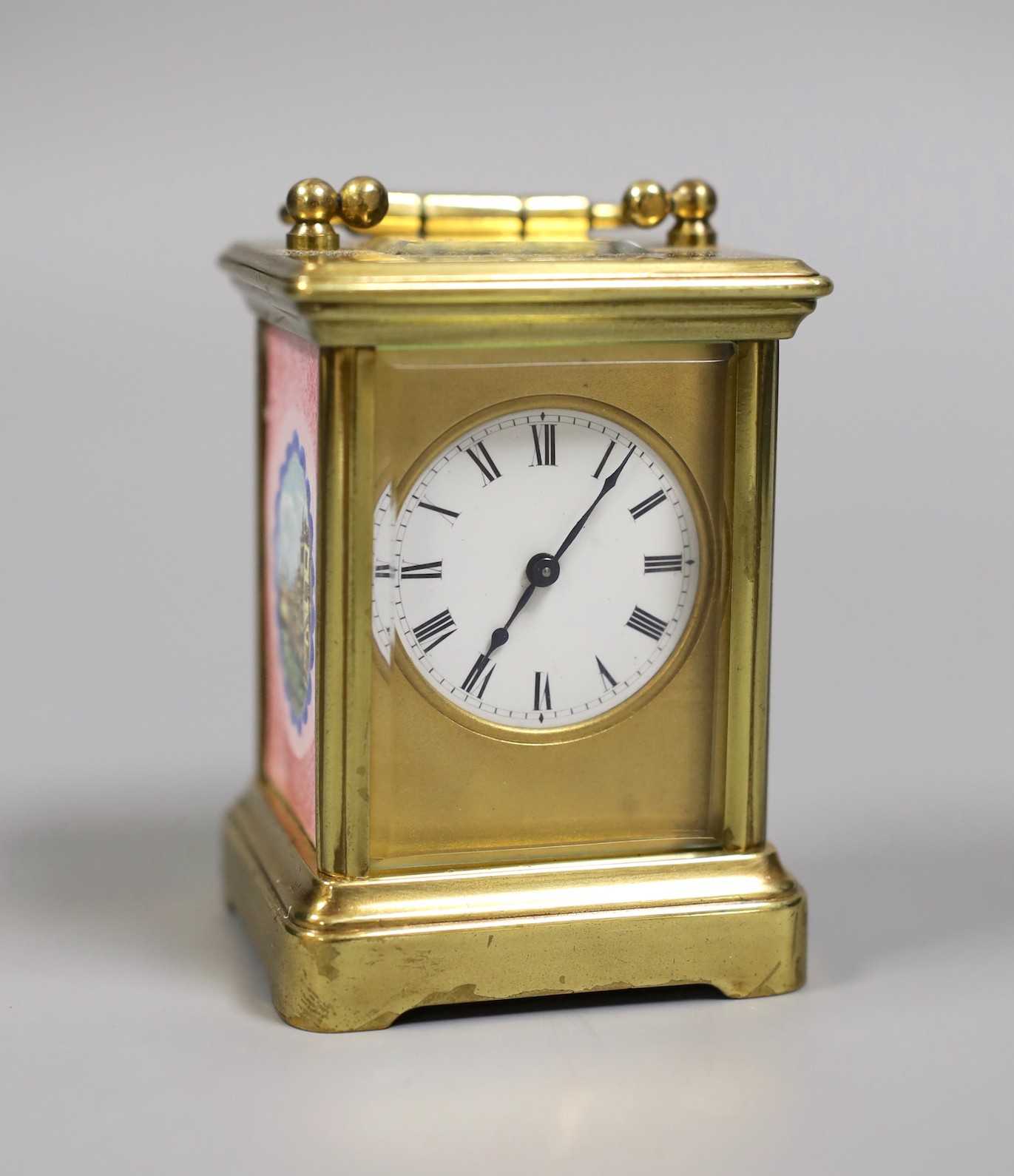 A miniature carriage timepiece, with enamelled side panels of Venice, 8 cms high